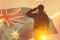 Double exposure of Silhouette of solider and the sunset or the sunrise against Australia flag. Anzac Day.