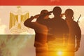 Double exposure of Silhouettes of soliders and the sunset or the sunrise against flag of Egypt.