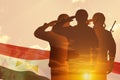 Double exposure of Silhouettes of soliders and the sunset or the sunrise against flag of Egypt.