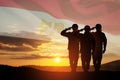 Double exposure of silhouettes of a soliders and the sunset or the sunrise against flag of Egypt.