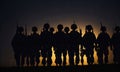 double exposure of silhouettes of a soliders and the sunset or the sunrise Royalty Free Stock Photo