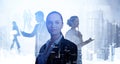 Double exposure of smiling positive young professionals. Silhouettes of diverse business people New York skyscrapers city view. Royalty Free Stock Photo