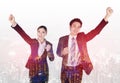 Double exposure of successful business man and woman with arm raised with a city Royalty Free Stock Photo