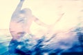 Double exposure of a surfer surfing in the ocean. Royalty Free Stock Photo