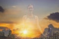 Double exposure-tranquility yoga woman meditation with sunset and twilight sky background,concept of pure spirituality and