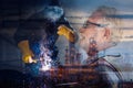 Double Exposure of Welder is Welding Pipeline Fabrication Assembly on Oil and Gas Refinery Manufacturing Plant Background. Royalty Free Stock Photo