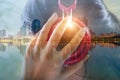 Double exposure of woman listening to music and cityscape in sun Royalty Free Stock Photo