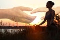 Double exposure of woman meditating and hands reaching each other outdoors. Yoga helping in daily life: harmony of mind Royalty Free Stock Photo