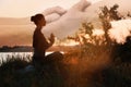 Double exposure of woman meditating and hands reaching each other outdoors. Yoga helping in daily life: harmony of mind Royalty Free Stock Photo