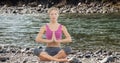 Double exposure of woman meditating at lake shore Royalty Free Stock Photo