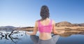 Double exposure of woman meditating at lakeshore Royalty Free Stock Photo