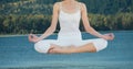 Double exposure of woman meditating over lake Royalty Free Stock Photo
