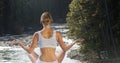 Double exposure of woman meditating on river at forest Royalty Free Stock Photo