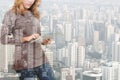 Double exposure of woman using tablet technology and urban build Royalty Free Stock Photo