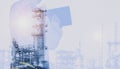 Double exposure worker with hand holding tablet in refinery plant