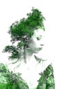 Double exposure of young beautiful girl among the leaves and trees. Portrait of a woman, mysterious look, creative, art, conceptua Royalty Free Stock Photo