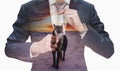 Double exposure young businessman tying necktie with leader wolf in sunset