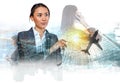 Double exposure of young businesswoman and urban office building, plane and financial graphs Royalty Free Stock Photo