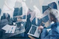 Double exposure of young coworkers working together on new startup project in modern office.Business meeting concept Royalty Free Stock Photo