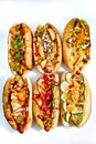 Fast food hotdog with beef sausage and fresh grilled vegetables with wheat bun on wooden background Royalty Free Stock Photo