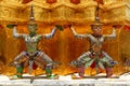 Double giant ramayana statues liftting golden pagoda