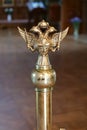 Double-headed eagle with two swords, cross and crown inside temple Royalty Free Stock Photo
