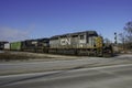 A double header diesel configuration pulls a freight across Broadway Street Royalty Free Stock Photo