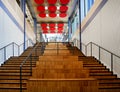 Double internal wooden staircase with metal handrail