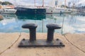 Double iron bollard for mooring boats to the pier Royalty Free Stock Photo