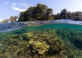 Double landscape with sea and sky. Seascape split photo. Tropical island greenery Royalty Free Stock Photo