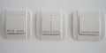 Double light switch on gray wall Royalty Free Stock Photo