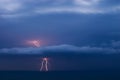 Double lightning strikes the sea