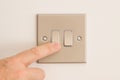 Double Lightswitch on a White Wall being pressed Royalty Free Stock Photo