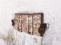 Double-locked wooden shutters in an old abandoned house