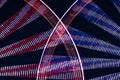 Double long exposure of a rotating ferris wheel in the night, abstract background with red and blue motion blur light tracks Royalty Free Stock Photo