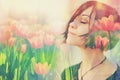 Double multiply exposure portrait of a dreamy cute woman meditating outdoors with eyes closed, combined with photograph of tulip Royalty Free Stock Photo