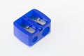 double pencil sharpener, blue color, on white background, close-up image