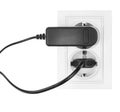 Double power European electric plug isolated on a white. Black electric cord plugged into a white electricity socket on white Royalty Free Stock Photo