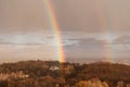 Double rainbow against the sunset sky. Leprechaun at the end of the rainbow. Rainbow as a concept of fantastic money Royalty Free Stock Photo