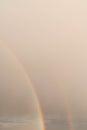 Double rainbow against the sunset sky. Leprechaun at the end of the rainbow. Rainbow as a concept of fantastic money Royalty Free Stock Photo