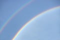 Double rainbow in a clear blue sky on a sunny day. Natural rainbow Royalty Free Stock Photo