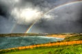 Double rainbow Crantock bay and beach North Cornwall England UK near Newquay in HDR Royalty Free Stock Photo