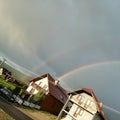 Double Rainbow over Cloudy Sky