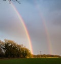 Double rainbow over field Royalty Free Stock Photo