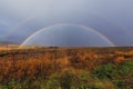 A double rainbow over a field in Iceland during Autumn Royalty Free Stock Photo