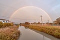 Double rainbow over river and countryside Royalty Free Stock Photo