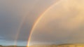 Double Rainbow over small city