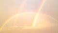 Double Rainbow Vivid Display in the Sky after a Thunderstorm at Sunrise Royalty Free Stock Photo