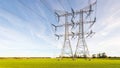 Double row of power lines and pylons in a flat Dutch rural land