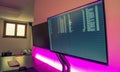 Double screen arm and led strips in a modern office studio